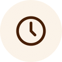 Icon of a clock with a brown border and hands pointing at approximately 10:10, set against a light beige circular background, reminiscent of the calming tones often found in a veterinarian's office.